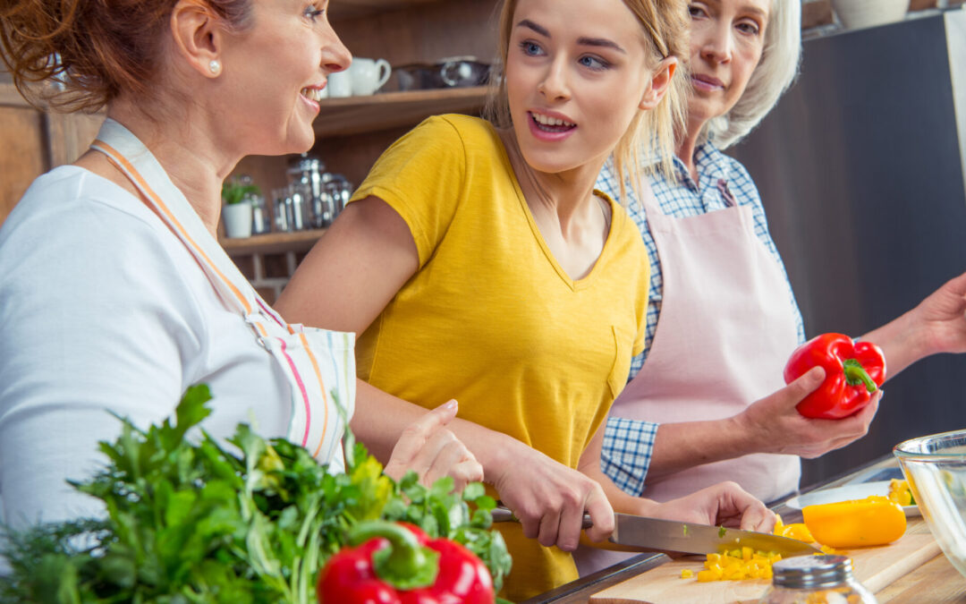 grandmother mother daughter cooking healthy in kitchen