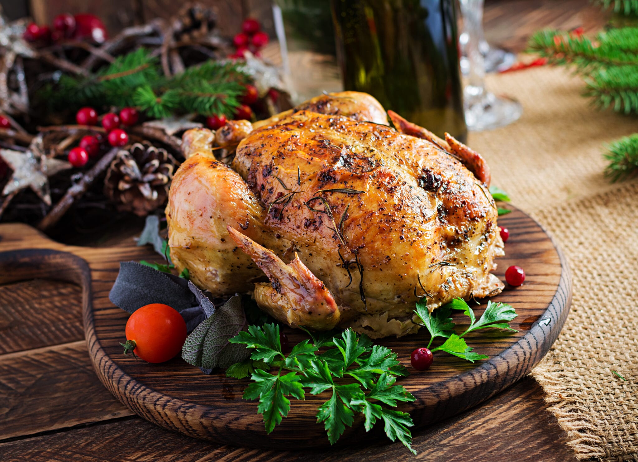 Baked chicken on a Christmas-themed cutting board