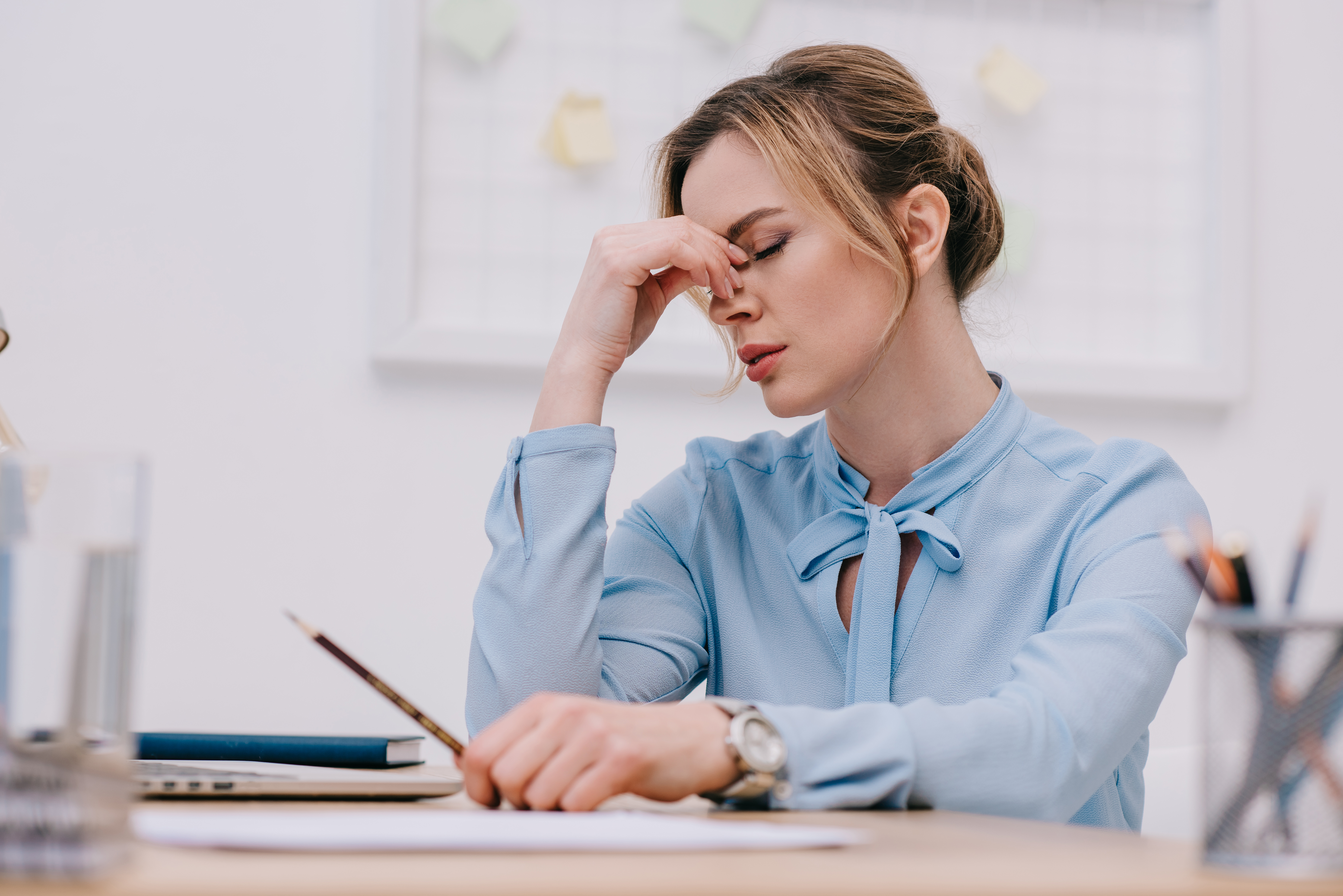 Businesswoman suffering from migraine