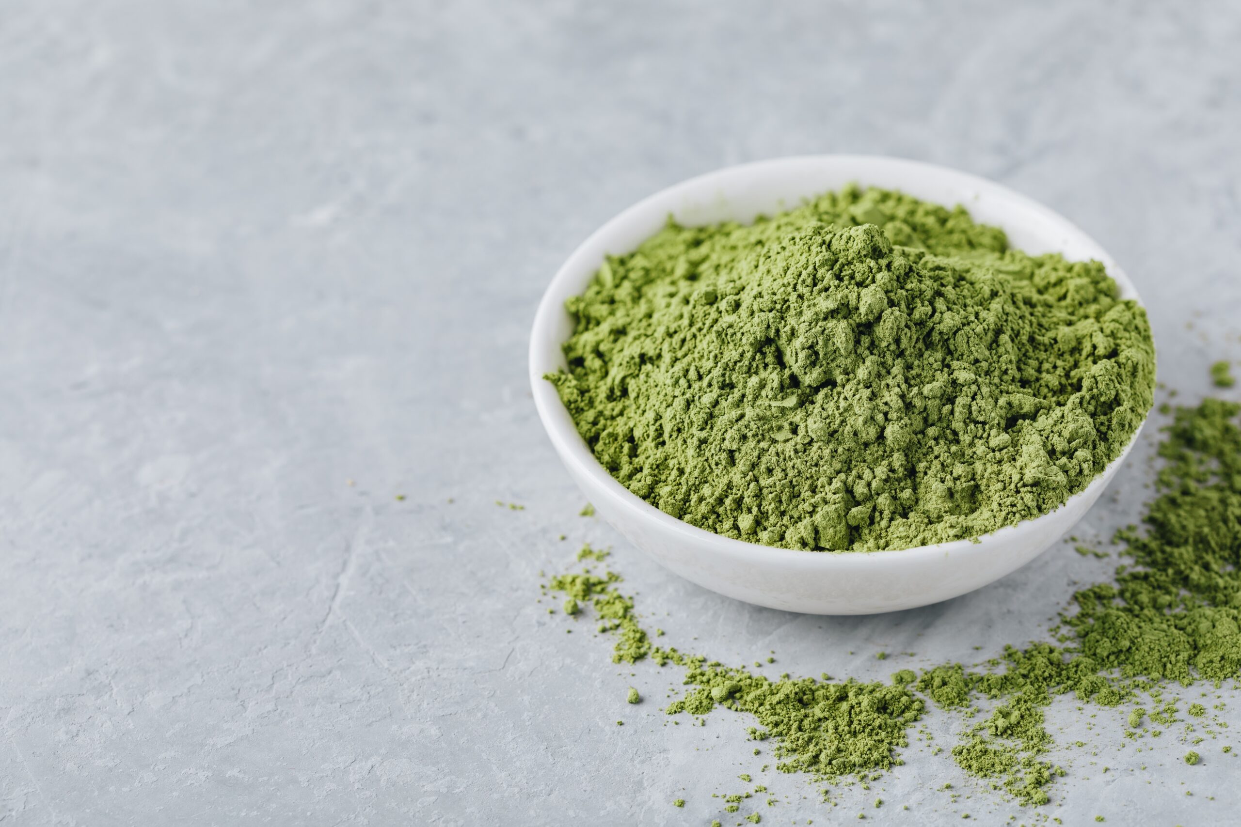 Super greens powder in white bowl
