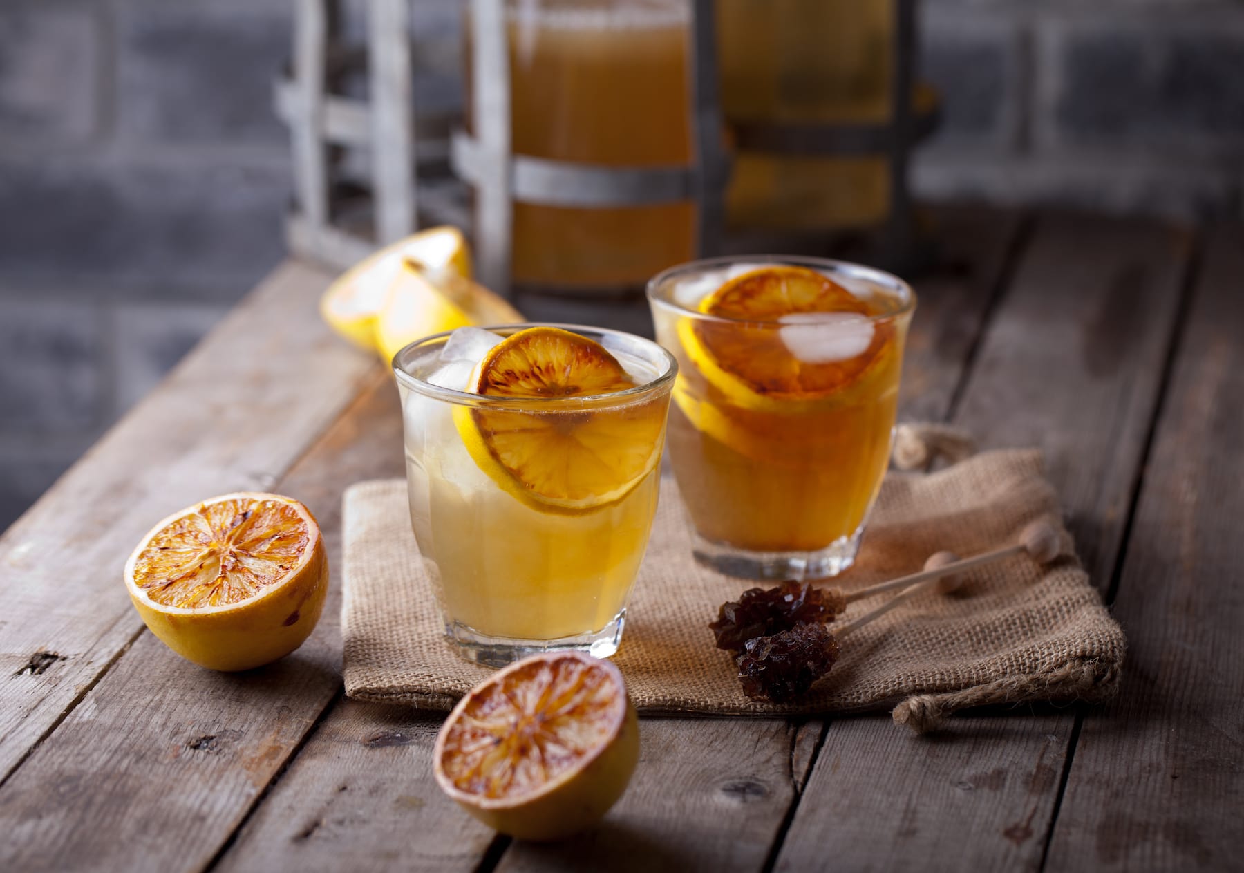 lemonade in glasses and bottles made of grilled lemons. cider.