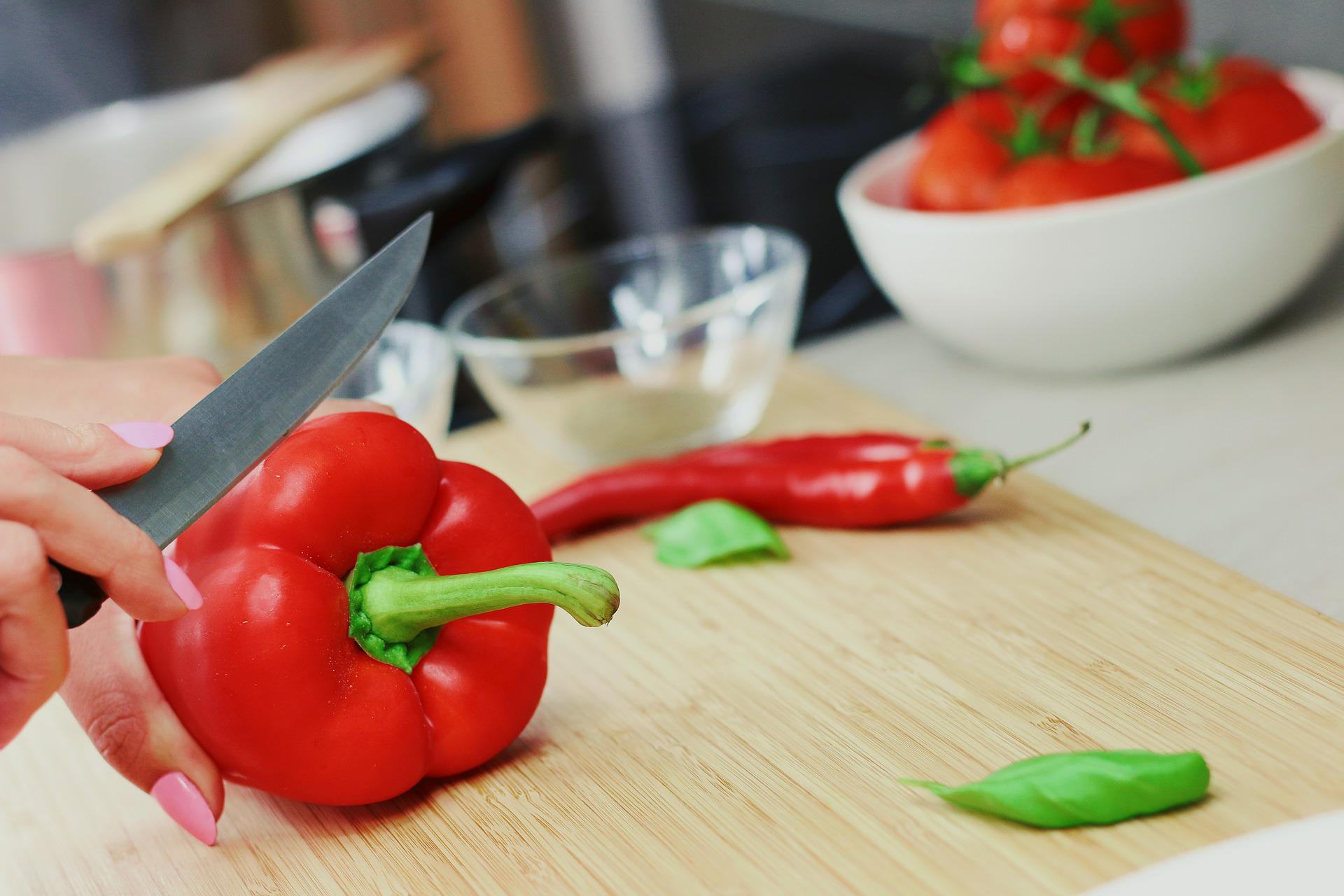 red bell peppers from garden being cut