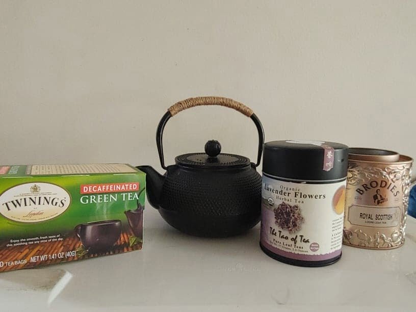 variety of teas and a tea pot