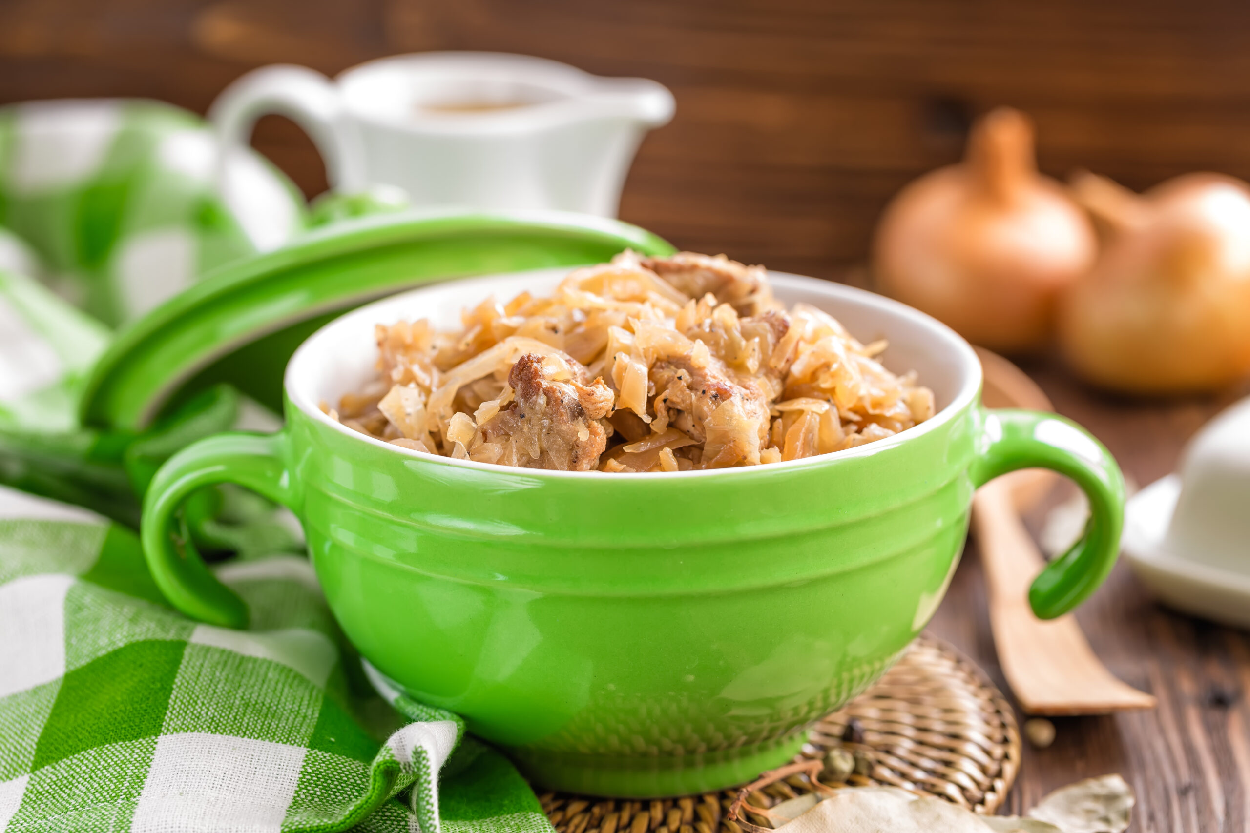 texas dirty rice with beef and cabbage in lime green bowl on table