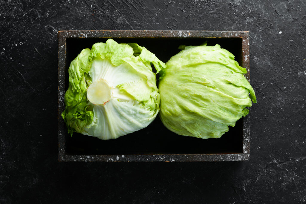 iceberg lettuce in a wooden box. top view. free copy space.