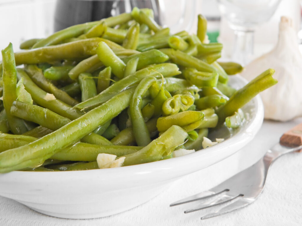 green beans salad with fork at dinner