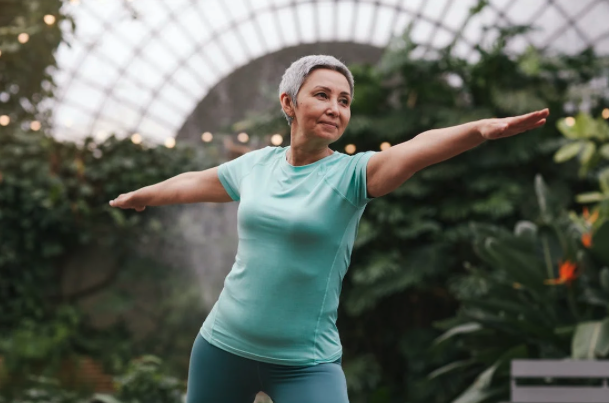 elderly woman doing yoga pose