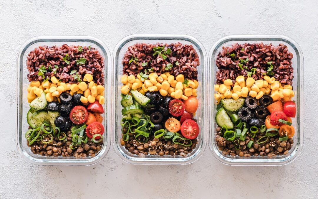 glass containers with salad for meal prep
