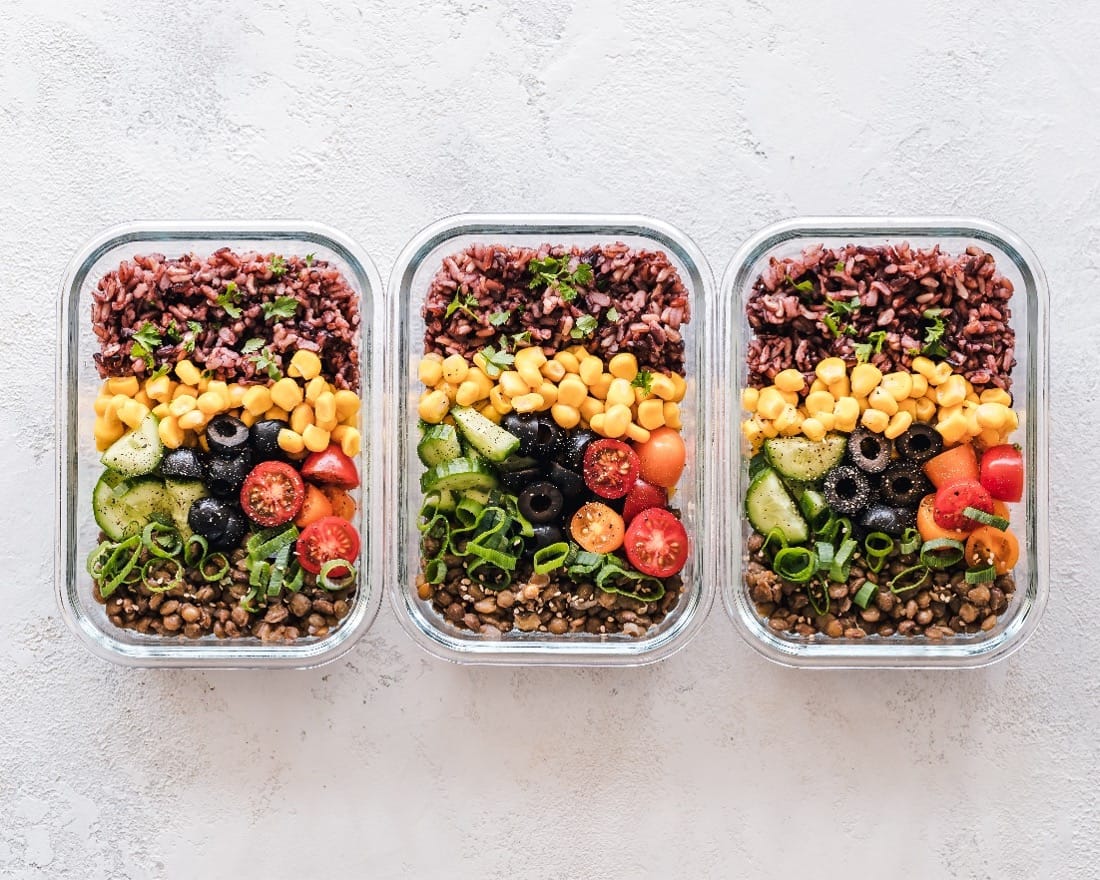 glass containers with salad for meal prep