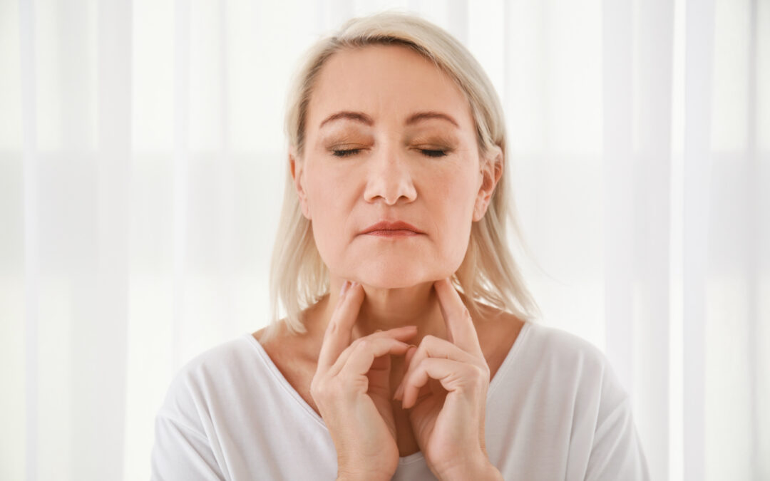 woman with thyroid gland problem at home