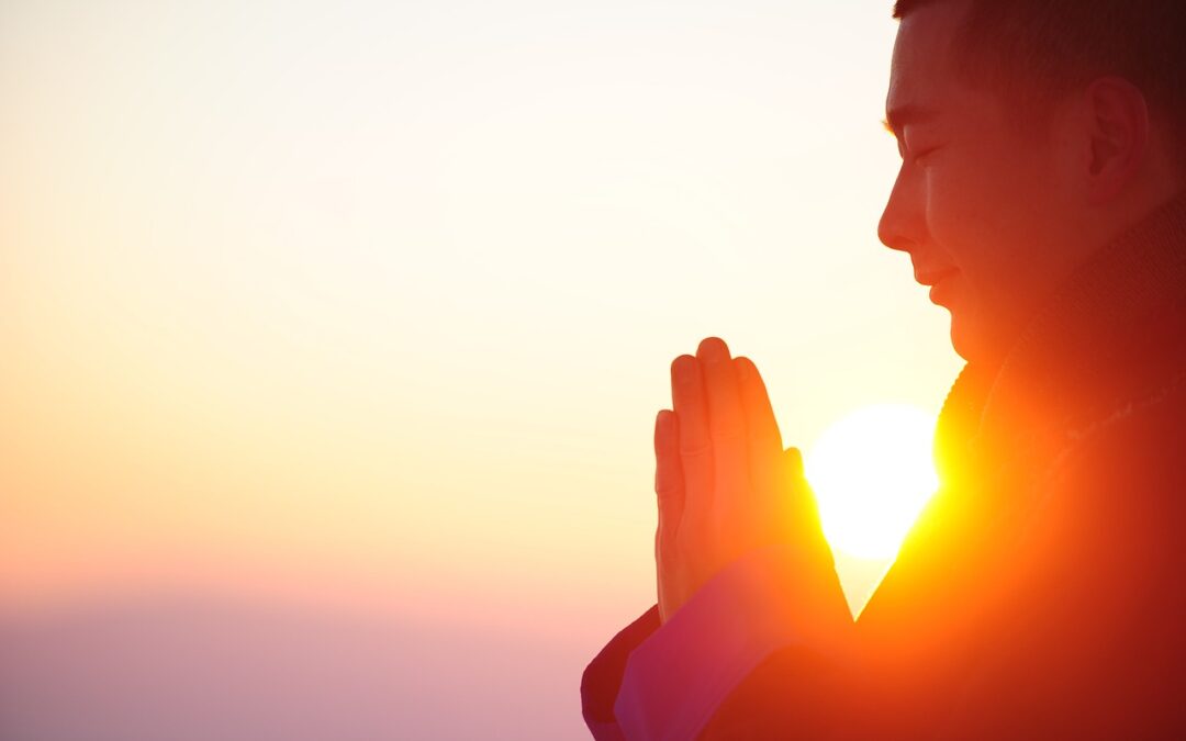 man_meditating_during_sunrise