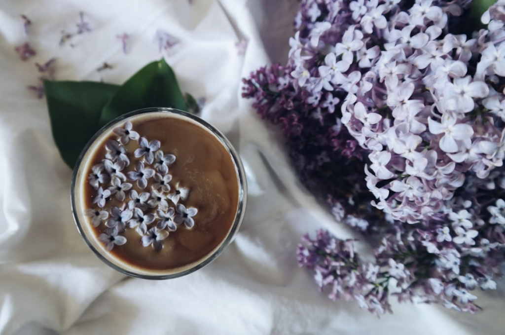 cup_of_herbal_tea_with_flowers_sprinkled_on_top