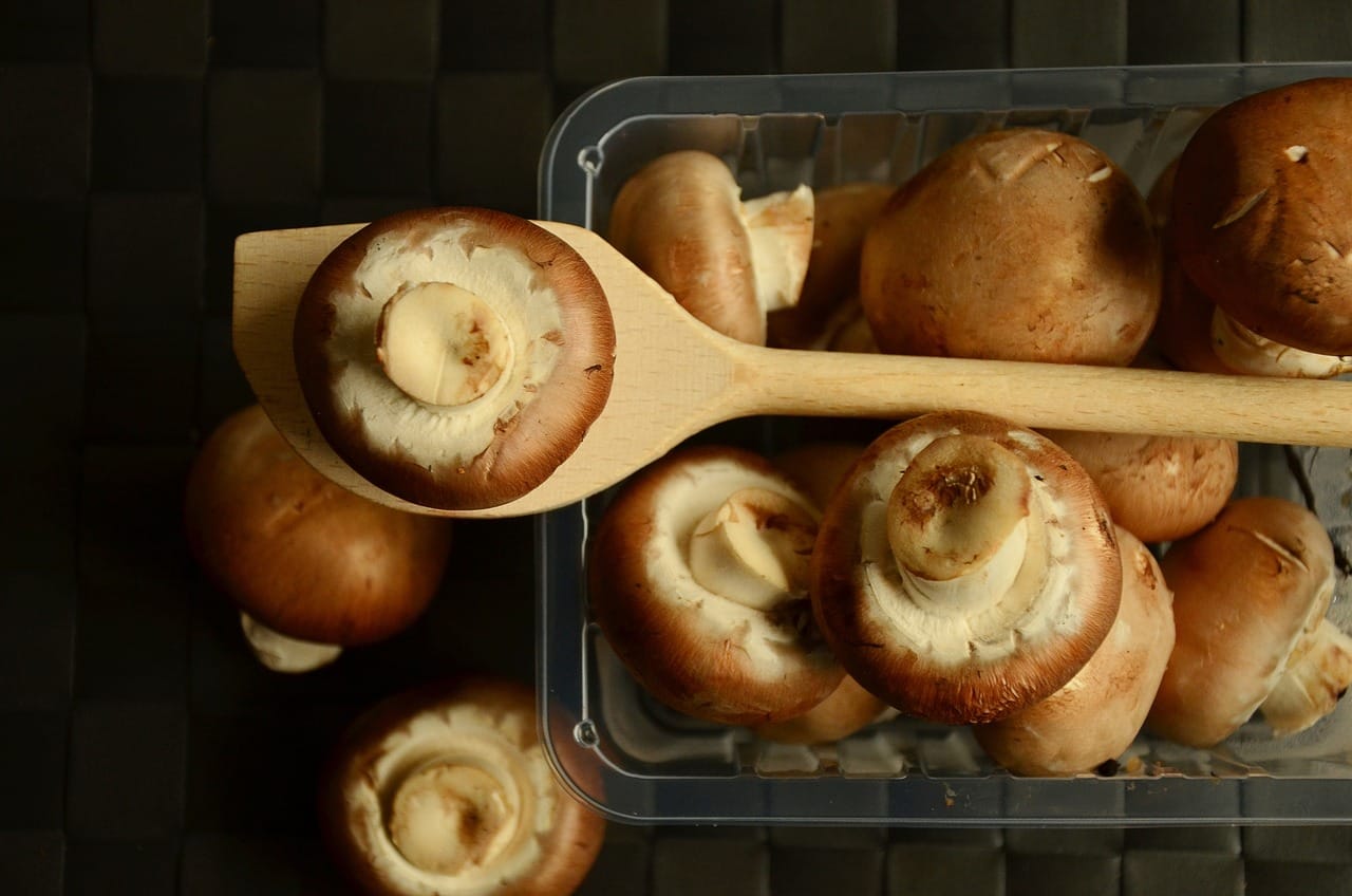 portobello_mushrooms_on_table_with_wooden_spoon
