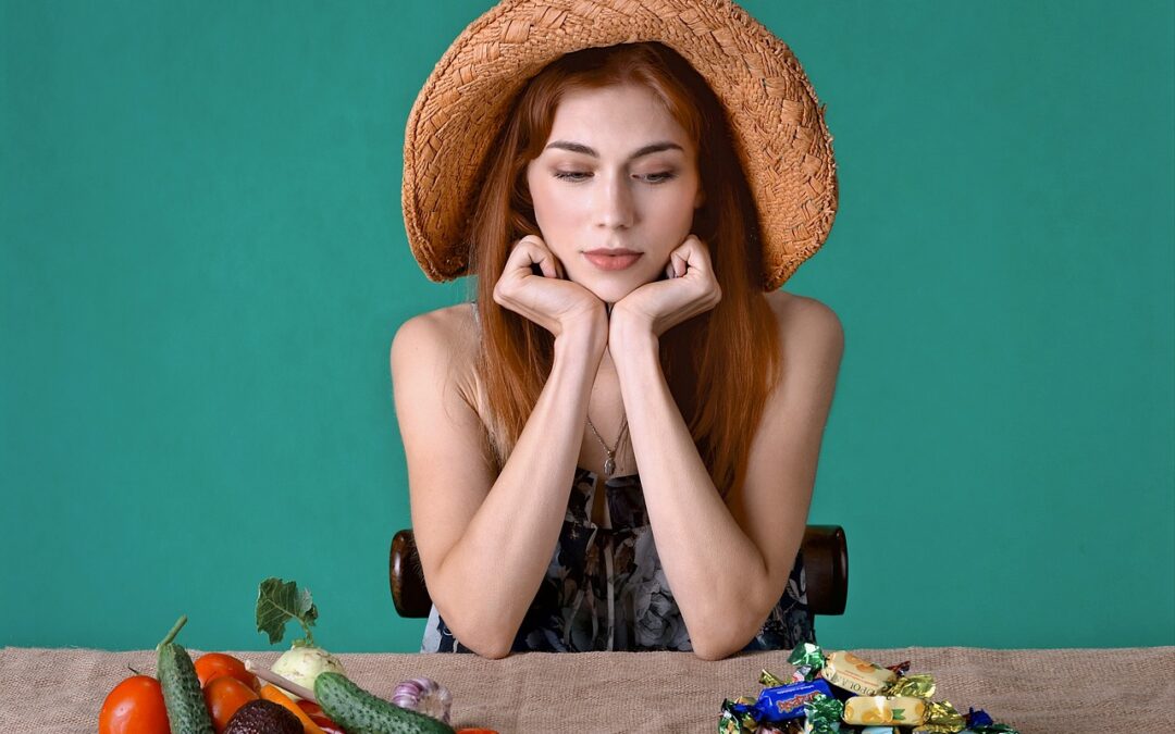 woman_counting_calories_between_vegetables_and_candy