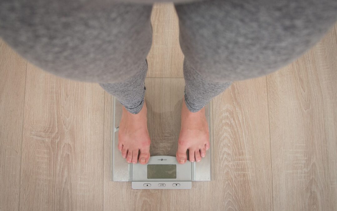 person_on_scale_starting_weight_loss_body_transformation