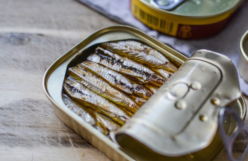 a tin of sardines with lid peeled back
