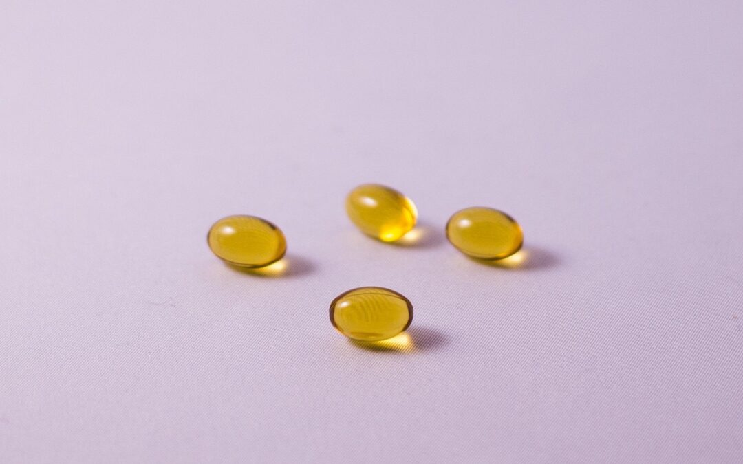 omega 3 capsules on purple background