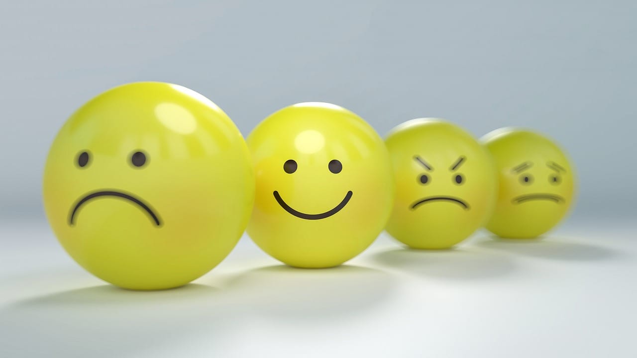 yellow smiley face balls sad, happy, mad, worried