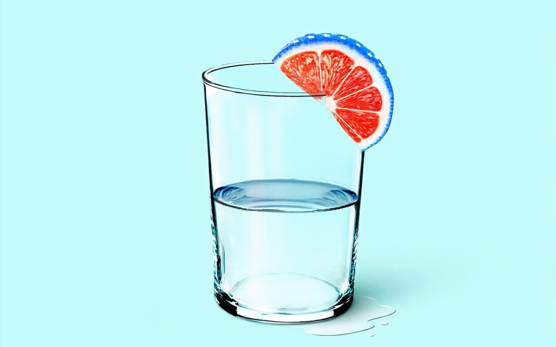 glass of water on light blue background